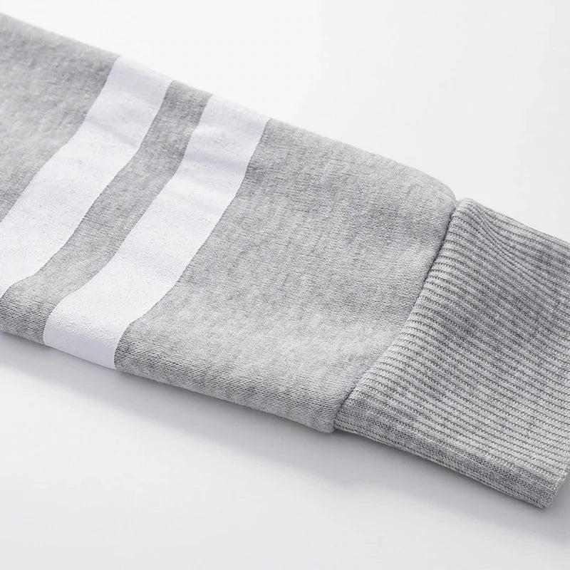 Sweat-shirt à capuche manches rayures